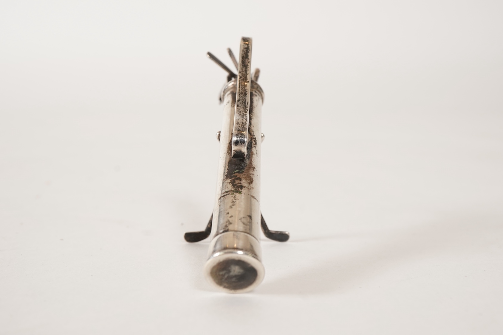 A set of six George V novelty silver cocktail sticks with holder, modelled as a golf bag with clubs, by John Nowill & Sons